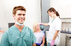 A dentist enquiring a lady patient